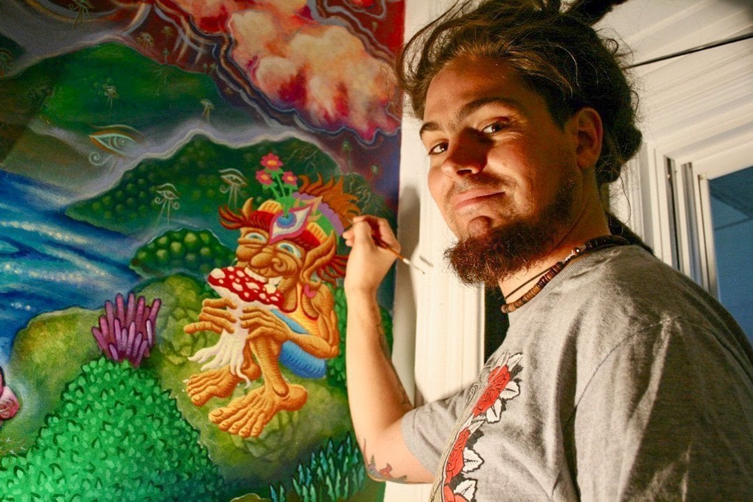 Chris Dyer painting Mushroom Cafe mural