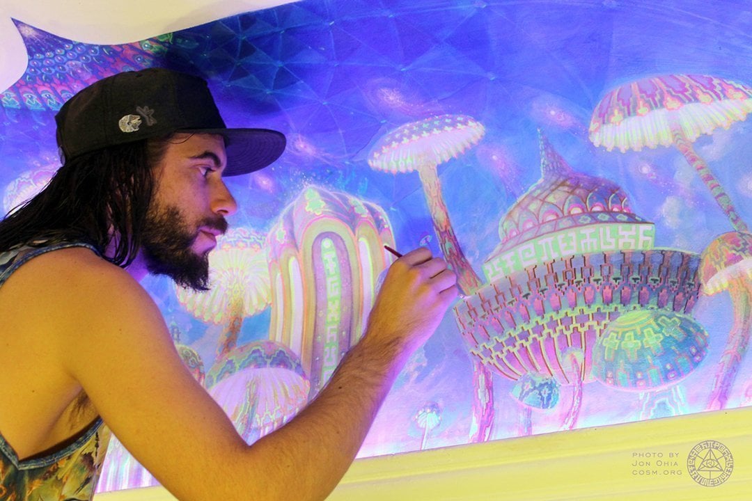 Jonathan Solter painting Mushroom Cafe mural